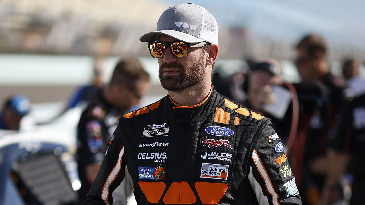 HOMESTEAD, FLORIDA - OCTOBER 26: Corey LaJoie, driver of the #51 Schluter Systems Ford, walks the grid during qualifying for the the NASCAR Cup Series Straight Talk Wireless 400 at Homestead-Miami Speedway on October 26, 2024 in Homestead, Florida.