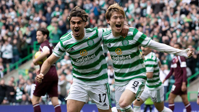GLASGOW, SCOTLAND - MAY 07: Celtic's Kyogo Furuhashi (R) celebrates making it 2-1 with Jota during a cinch Premiership match between Celtic and Hearts at Celtic Park, on May 07, 2022, in Glasgow, Scotland.