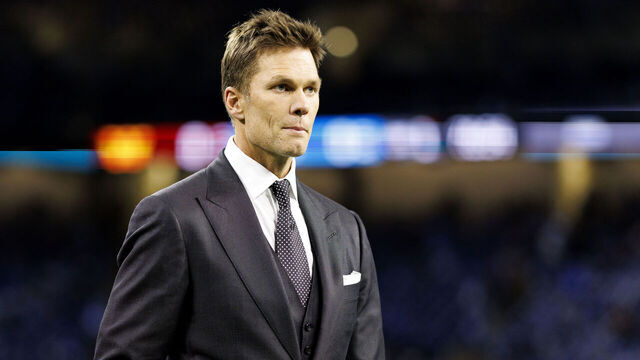DETROIT, MICHIGAN - JANUARY 18: Fox Sports commentator Tom Brady stands on the field prior to the NFC Divisional Playoff game between the Washington Commanders and the Detroit Lions, at Ford Field on January 18, 2025 in Detroit, Michigan.