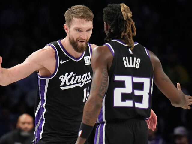 BROOKLYN, NY - JANUARY 27: Domantas Sabonis #11 and Keon Ellis #23 of the Sacramento Kings high five during the game against the Brooklyn Nets on January 27, 2025 at Barclays Center in Brooklyn, New York. Mandatory Copyright Notice: Copyright 2025 NBAE