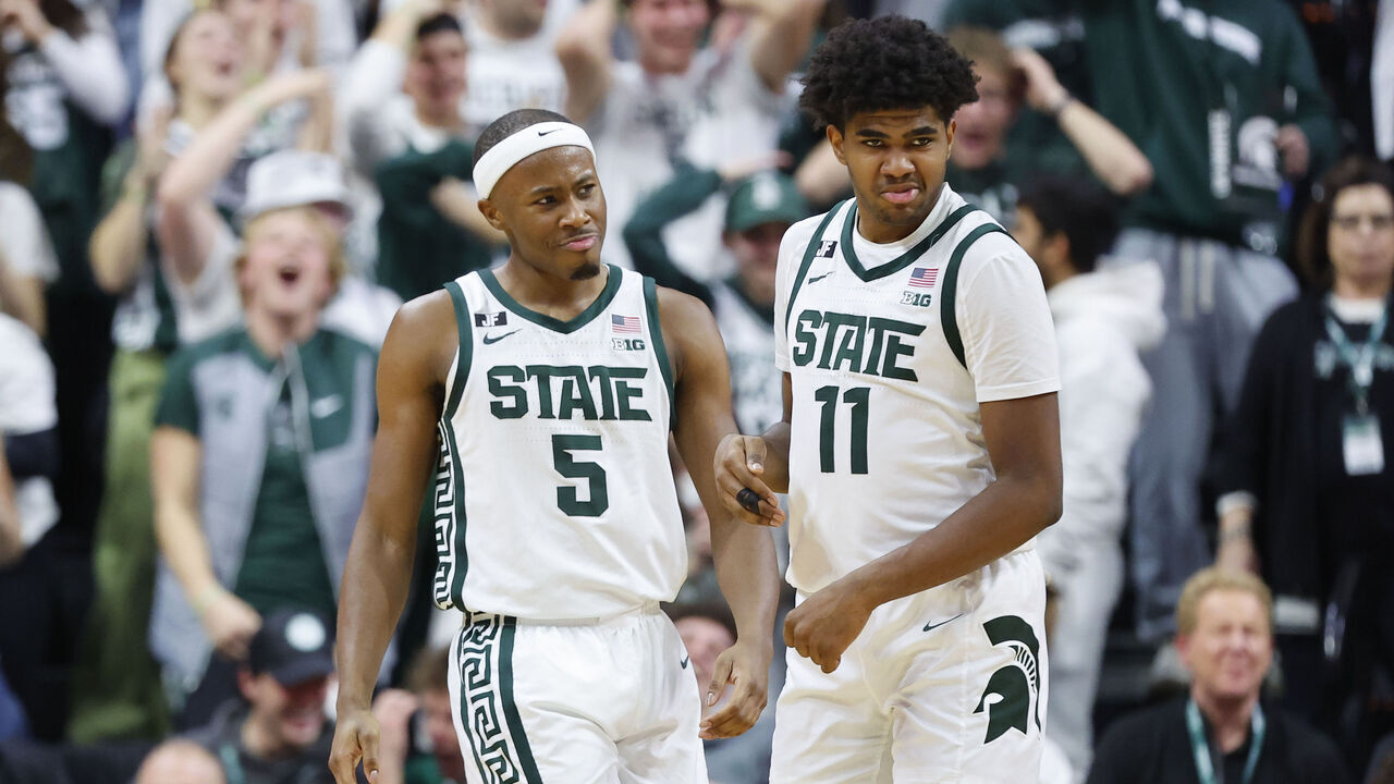 EAST LANSING, MICHIGAN - JANUARY 28: Tre Holloman #5 and Jase Richardson #11 of the Michigan State Spartans celebrates late in the second half against the Minnesota Golden Gophers at Breslin Center on January 28, 2025 in East Lansing, Michigan.