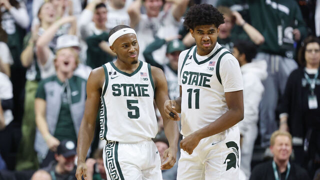 EAST LANSING, MICHIGAN - JANUARY 28: Tre Holloman #5 and Jase Richardson #11 of the Michigan State Spartans celebrates late in the second half against the Minnesota Golden Gophers at Breslin Center on January 28, 2025 in East Lansing, Michigan.
