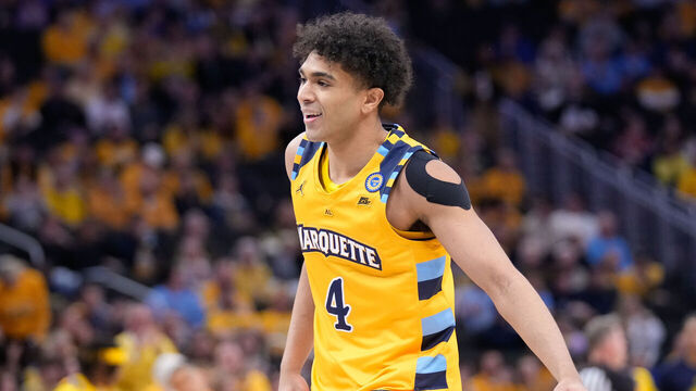 MILWAUKEE, WISCONSIN - JANUARY 24: Stevie Mitchell #4 of the Marquette Golden Eagles reacts to scoring a three point basket during the first half against the Villanova Wildcats at Fiserv Forum on January 24, 2025 in Milwaukee, Wisconsin.