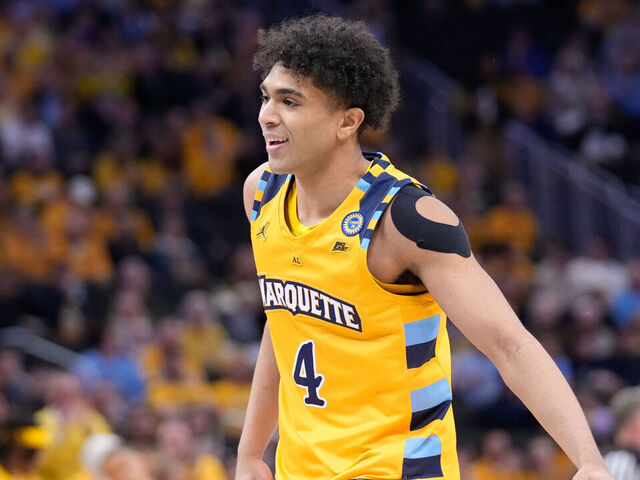 MILWAUKEE, WISCONSIN - JANUARY 24: Stevie Mitchell #4 of the Marquette Golden Eagles reacts to scoring a three point basket during the first half against the Villanova Wildcats at Fiserv Forum on January 24, 2025 in Milwaukee, Wisconsin.