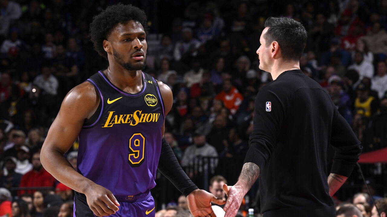 PHILADELPHIA, PA - JANUARY 28: Bronny James #9 and Head Coach JJ Redick of the Los Angeles Lakers high five during the game against the Philadelphia 76ers on January 28, 2025 at the Wells Fargo Center in Philadelphia, Pennsylvania NOTE TO USER: User expressly acknowledges and agrees that, by downloading and/or using this Photograph, user is consenting to the terms and conditions of the Getty Images License Agreement. Mandatory Copyright Notice: Copyright 2025 NBAE