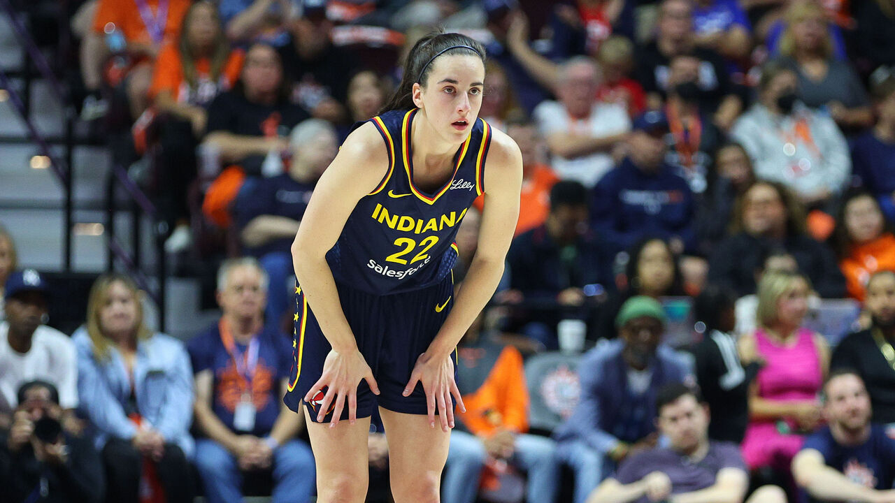 UNCASVILLE, CT - SEPTEMBER 22: Indiana Fever guard Caitlin Clark (22) looks on as free throws are attempted during the First Round and game 1 of the 2024 WNBA playoffs between Indiana Fever and Connecticut Sun on September 22, 2024, at Mohegan Sun Arena in Uncasville, CT.
