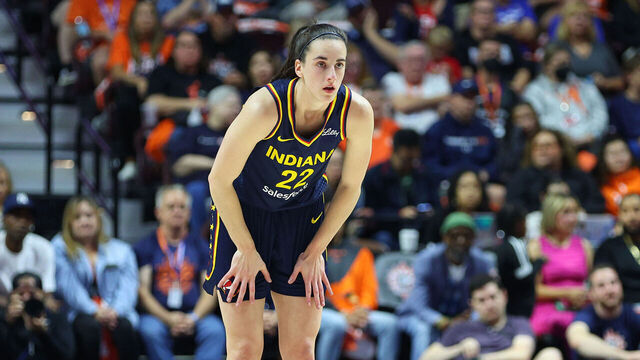 UNCASVILLE, CT - SEPTEMBER 22: Indiana Fever guard Caitlin Clark (22) looks on as free throws are attempted during the First Round and game 1 of the 2024 WNBA playoffs between Indiana Fever and Connecticut Sun on September 22, 2024, at Mohegan Sun Arena in Uncasville, CT.