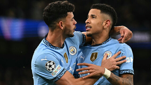 Manchester City's Brazilian midfielder #26 Savinho (R) celebrates with Manchester City's Portuguese midfielder #27 Matheus Nunes after scoring the team's third goal during the UEFA Champions League football match between Manchester City and Club Brugge at the Etihad Stadium in Manchester, north west England, on January 29, 2025.