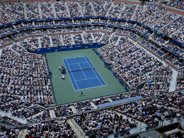 TOPSHOT - An overall view inside Arthur Ashe Stadium as Italy's Jannik Sinner and Australia's Christopher O'Connell play during their men's singles third round match on day six of the US Open tennis tournament at the USTA Billie Jean King National Tennis Center in New York City, on August 31, 2024.