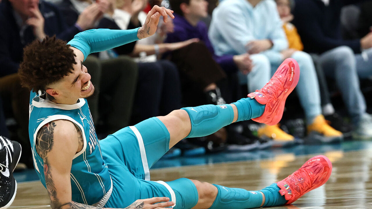 CHARLOTTE, NORTH CAROLINA - JANUARY 27: LaMelo Ball #1 of the Charlotte Hornets falls to the ground following a left ankle sprain during the second quarter of the game against the Los Angeles Lakers at Spectrum Center on January 27, 2025 in Charlotte, North Carolina.
