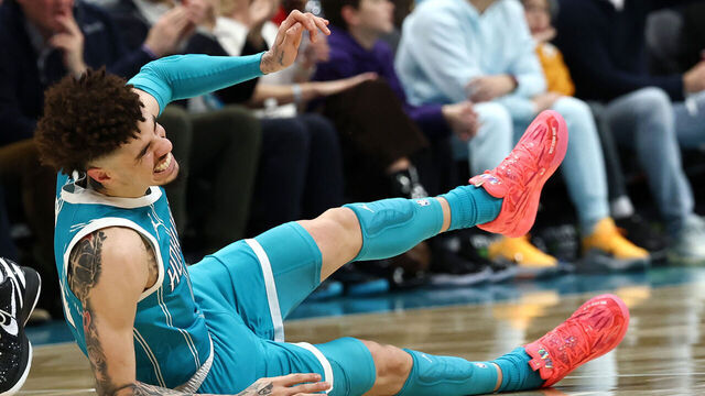 CHARLOTTE, NORTH CAROLINA - JANUARY 27: LaMelo Ball #1 of the Charlotte Hornets falls to the ground following a left ankle sprain during the second quarter of the game against the Los Angeles Lakers at Spectrum Center on January 27, 2025 in Charlotte, North Carolina.