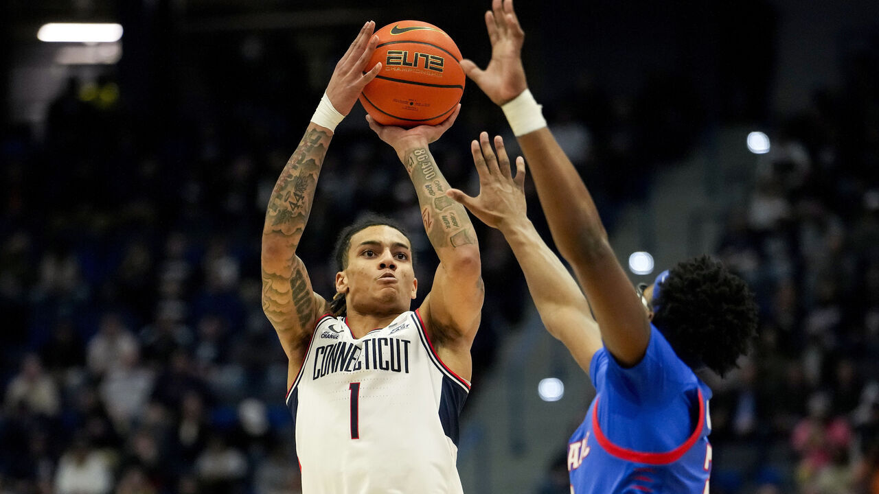 HARTFORD, CONNECTICUT - JANUARY 29: Solo Ball #1 of the Connecticut Huskies shoots against Layden Blocker #2 of the DePaul Blue Demons during the first half of an NCAA basketball game at the XL Center on January 29, 2025 in Hartford, Connecticut.
