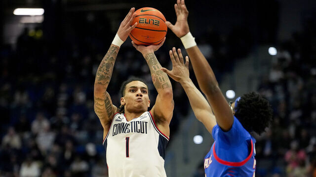 HARTFORD, CONNECTICUT - JANUARY 29: Solo Ball #1 of the Connecticut Huskies shoots against Layden Blocker #2 of the DePaul Blue Demons during the first half of an NCAA basketball game at the XL Center on January 29, 2025 in Hartford, Connecticut.