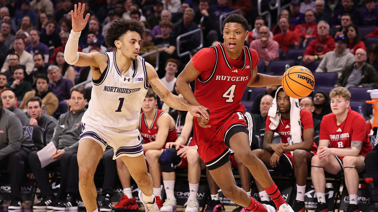 EVANSTON, ILLINOIS - JANUARY 29: Ace Bailey #4 of the Rutgers Scarlet Knights drives to the basket against Jalen Leach #1 of the Northwestern Wildcats during the second half at Welsh-Ryan Arena on January 29, 2025 in Evanston, Illinois.