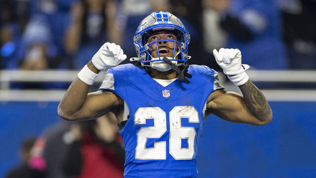 DETROIT, MICHIGAN - JANUARY 18: Jahmyr Gibbs #26 of the Detroit Lions celebrates after scoring a touchdown during an NFL Football game against the Washington Commanders at Ford Field on January 18, 2025 in Detroit, Michigan.