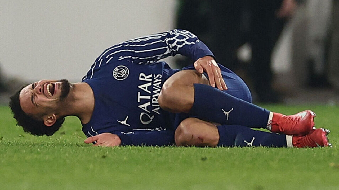 Paris Saint-Germain's French midfielder #33 Warren Zaire-Emery reacts after sustaining an injury during the UEFA Champions League football match VfB Stuttgart vs Paris Saint-Germain in Stuttgart, southwestern Germany, on January 29, 2025.