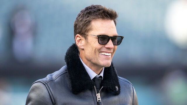 PHILADELPHIA, PA - JANUARY 12: NFL legend and Fox commentator Tom Brady smiles before the NFC Wild Card playoff game between the Green Bay Packers and the Philadelphia Eagles on January 12th, 2025 at Lincoln Financial Field in Philadelphia, PA.