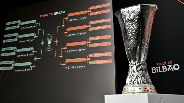 TOPSHOT - The trophy is on display next to a giant screen showing fixtures during the 2024-2025 UEFA Europa League football tournament knockout play-off draw at the House of European Football in Nyon, on January 31, 2025.