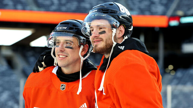EAST RUTHERFORD, NEW JERSEY - FEBRUARY 16: (L-R) Morgan Frost #48 and Joel Farabee #86 of the Philadelphia Flyers pose for a photo before practice at MetLife Stadium on February 16, 2024 in East Rutherford, New Jersey.
