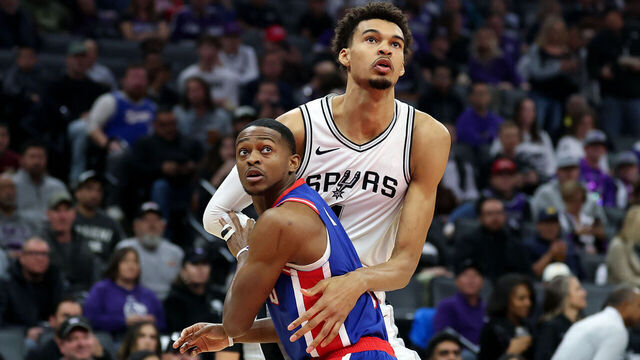SACRAMENTO, CALIFORNIA - DECEMBER 01: Victor Wembanyama #1 of the San Antonio Spurs and De'Aaron Fox #5 of the Sacramento Kings go for a rebound in the first half at Golden 1 Center on December 01, 2024 in Sacramento, California. NOTE TO USER: User expressly acknowledges and agrees that, by downloading and/or using this photograph, user is consenting to the terms and conditions of the Getty Images License Agreement.