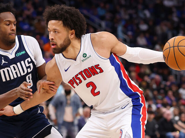 DETROIT, MICHIGAN - JANUARY 31: Cade Cunningham #2 of the Detroit Pistons looks to drive around Olivier-Maxence Prosper #8 of the Dallas Mavericks during the second half at Little Caesars Arena on January 31, 2025 in Detroit, Michigan. Detroit won the game 117-102. NOTE TO USER: User expressly acknowledges and agrees that, by downloading and or using this photograph, User is consenting to the terms and conditions of the Getty Images License.