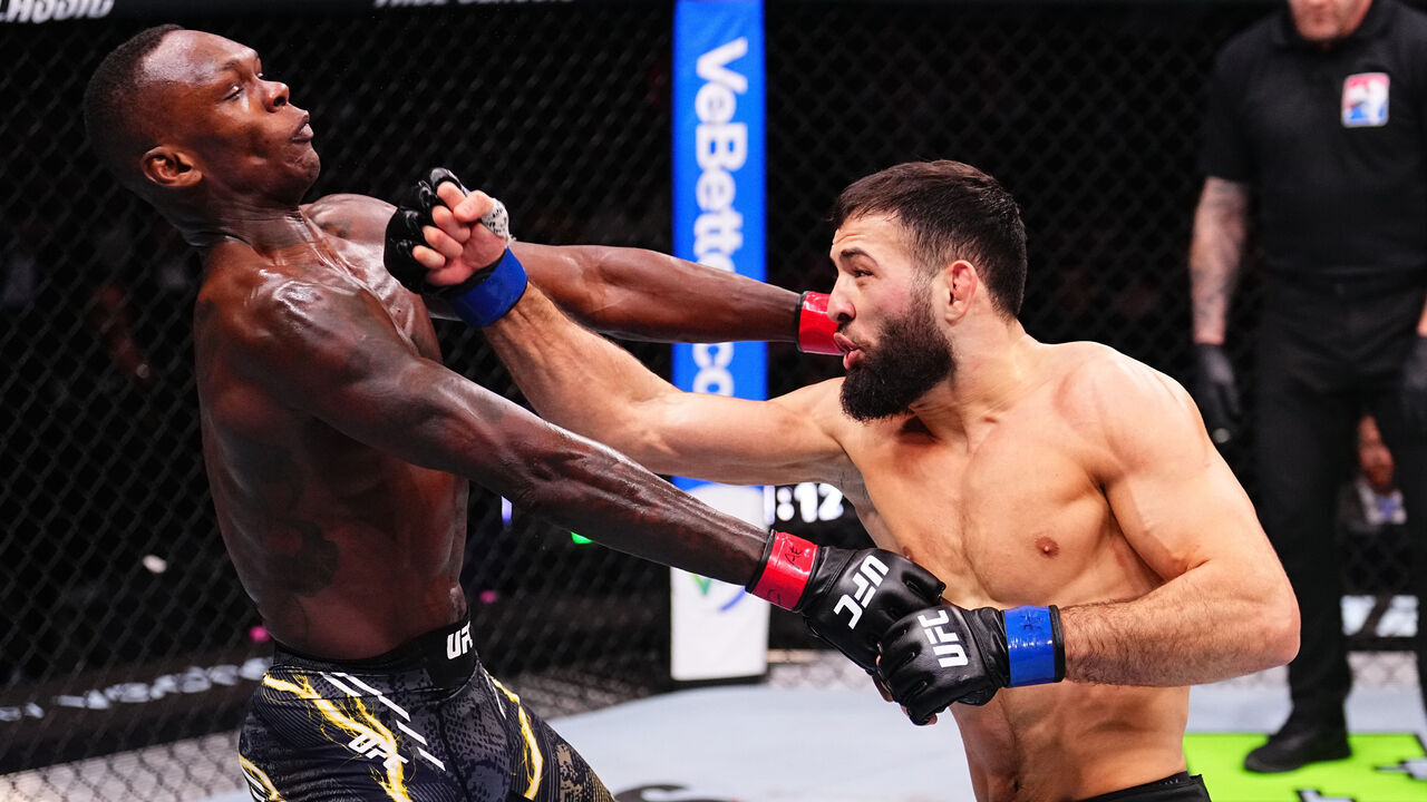 RIYADH, SAUDI ARABIA - FEBRUARY 01: (R-L) Nassourdine Imavov of Russia punches Israel Adesanya of Nigeria in a middleweight fight during the UFC Fight Night event at anb Arena on February 01, 2025 in Riyadh, Saudi Arabia.