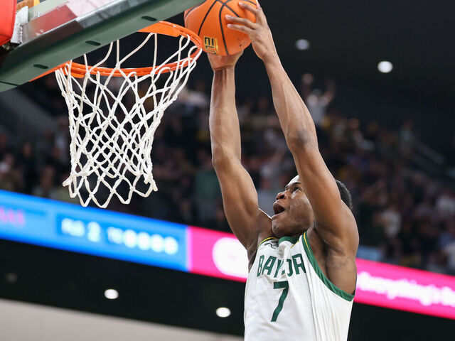 WACO, TX - FEBRUARY 01: Baylor Bears guard VJ Edgecombe (7) dunks the ball during the Big 12 college basketball game between Baylor Bears and Kansas Jayhawks on February 1, 2025, at Foster Pavilion in Waco, Texas.