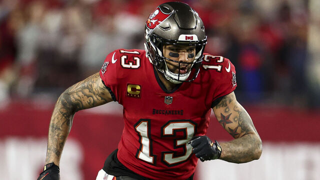 TAMPA, FLORIDA - JANUARY 12: Mike Evans #13 of the Tampa Bay Buccaneers runs downfield during the second half of an NFL football wild card playoff game against the Washington Commanders at Raymond James Stadium on January 12, 2025 in Tampa, Florida.