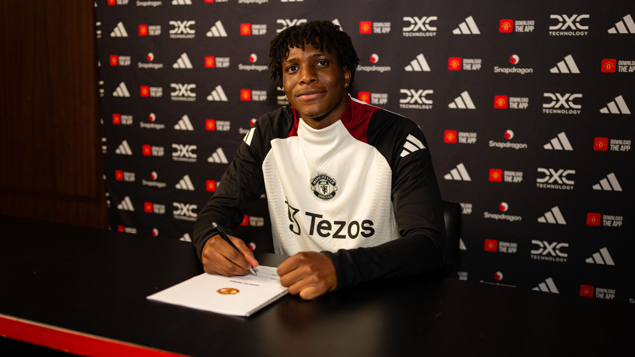 MANCHESTER, ENGLAND - FEBRUARY 02: (EXCLUSIVE COVERAGE) Patrick Dorgu of Manchester United poses after signing for the club at Carrington Training Ground on February 02, 2025 in Manchester, England.
