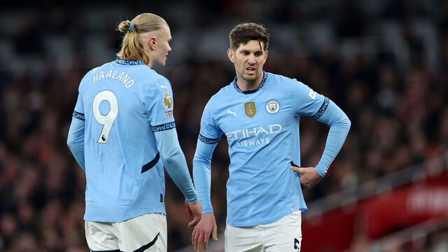 LONDON, ENGLAND - FEBRUARY 02: Erling Haaland of Manchester City speaks with John Stones during the Premier League match between Arsenal FC and Manchester City FC at Emirates Stadium on February 02, 2025 in London, England.