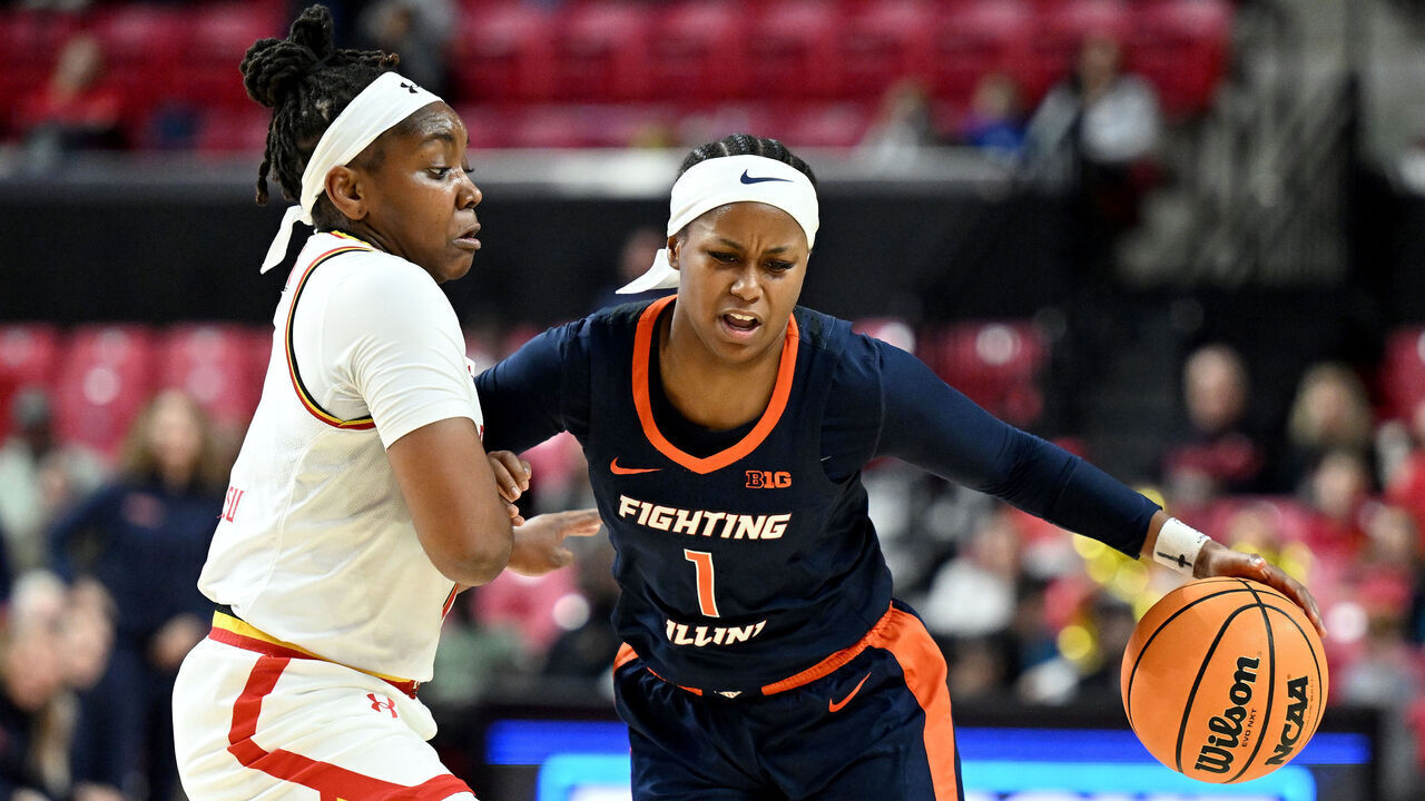 COLLEGE PARK, MARYLAND - FEBRUARY 02: Genesis Bryant #1 of the Illinois Fighting Illini handles the ball in the second quarter against Sarah Te-Biasu #1 of the Maryland Terrapins at Xfinity Center on February 02, 2025 in College Park, Maryland.