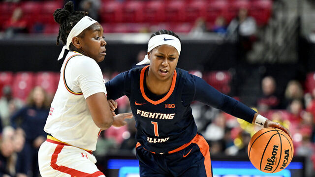 COLLEGE PARK, MARYLAND - FEBRUARY 02: Genesis Bryant #1 of the Illinois Fighting Illini handles the ball in the second quarter against Sarah Te-Biasu #1 of the Maryland Terrapins at Xfinity Center on February 02, 2025 in College Park, Maryland.