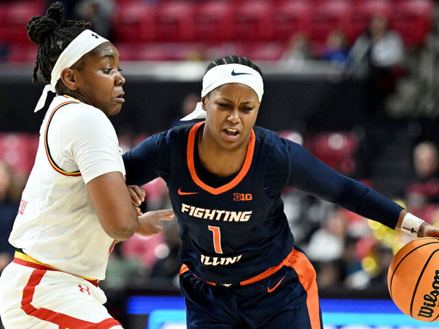COLLEGE PARK, MARYLAND - FEBRUARY 02: Genesis Bryant #1 of the Illinois Fighting Illini handles the ball in the second quarter against Sarah Te-Biasu #1 of the Maryland Terrapins at Xfinity Center on February 02, 2025 in College Park, Maryland.