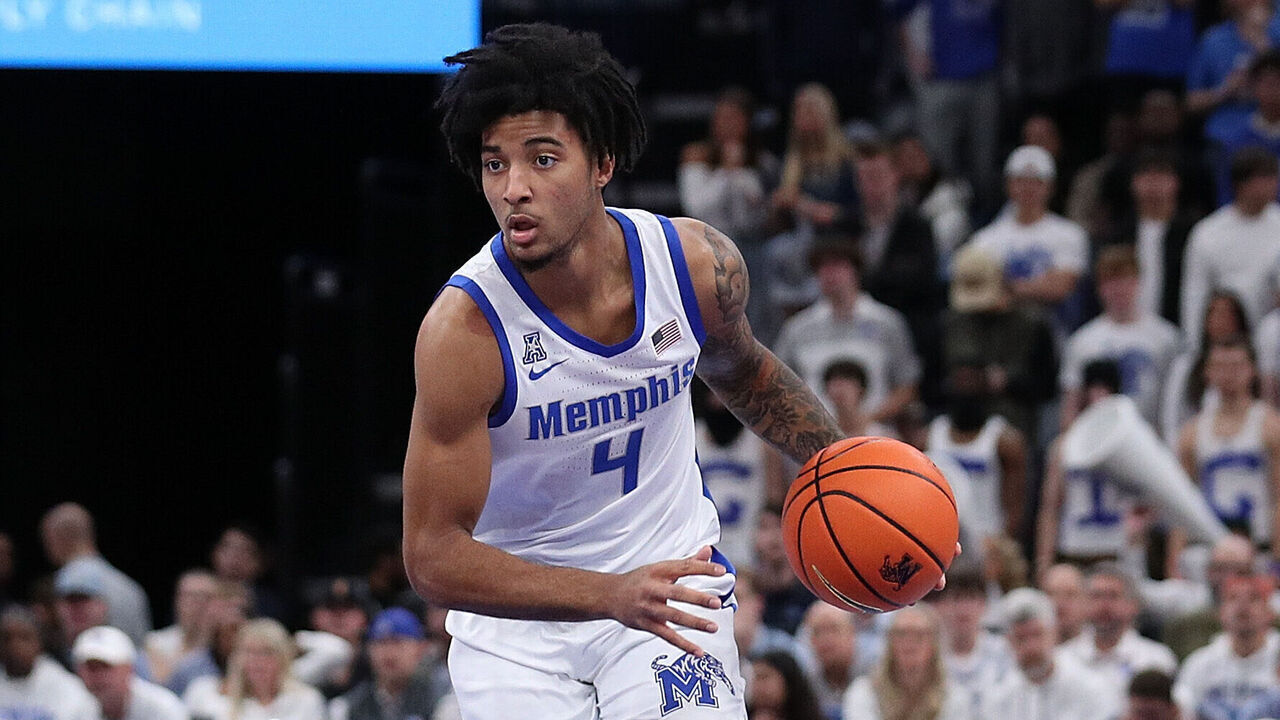MEMPHIS, TENNESSEE - DECEMBER 28: PJ Haggerty #4 of the Memphis Tigers handles the ball during the game against the Mississippi Rebels at FedExForum on December 28, 2024 in Memphis, Tennessee.