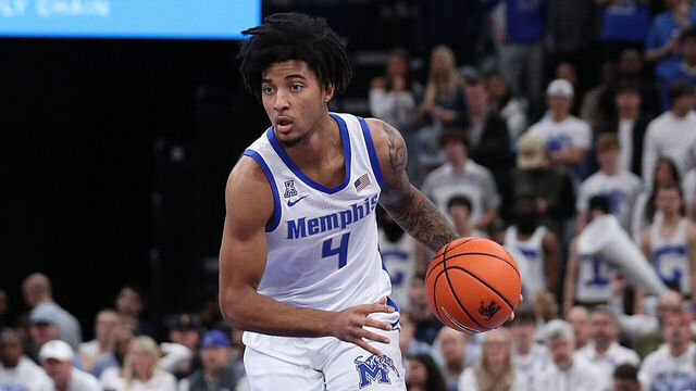 MEMPHIS, TENNESSEE - DECEMBER 28: PJ Haggerty #4 of the Memphis Tigers handles the ball during the game against the Mississippi Rebels at FedExForum on December 28, 2024 in Memphis, Tennessee.