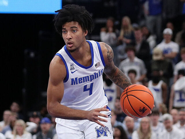 MEMPHIS, TENNESSEE - DECEMBER 28: PJ Haggerty #4 of the Memphis Tigers handles the ball during the game against the Mississippi Rebels at FedExForum on December 28, 2024 in Memphis, Tennessee.
