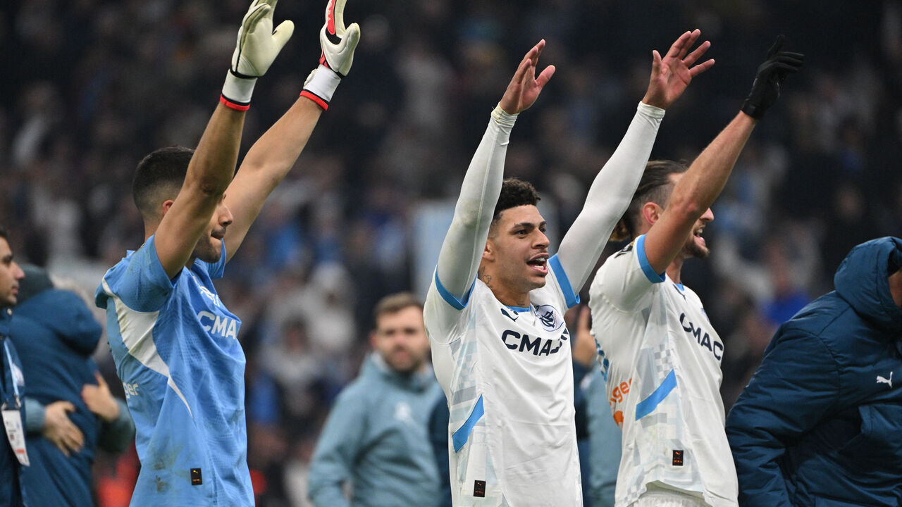 Marseille's Brazilian forward #44 Luis Henrique (C) and Marseille's French midiefdler #25 Adrien Rabiot celebrate after winning the French L1 football match between Olympique de Marseille (OM) and Olympique Lyonnais (OL) at Stade Velodrome in Marseille, south-eastern France, on February 2, 2025.