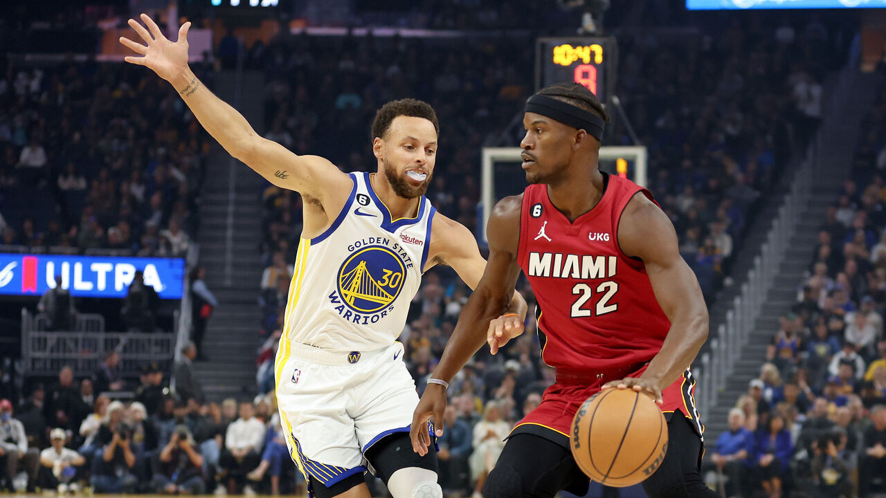 SAN FRANCISCO, CALIFORNIA - OCTOBER 27: Jimmy Butler #22 of the Miami Heat is guarded by Stephen Curry #30 of the Golden State Warriors at Chase Center on October 27, 2022 in San Francisco, California.
