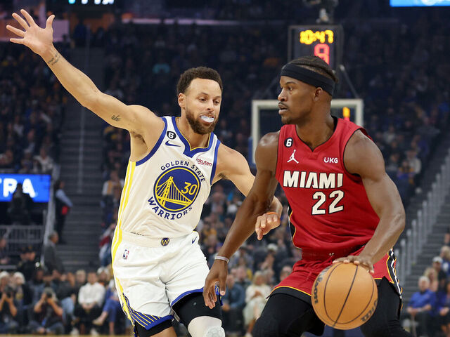 SAN FRANCISCO, CALIFORNIA - OCTOBER 27: Jimmy Butler #22 of the Miami Heat is guarded by Stephen Curry #30 of the Golden State Warriors at Chase Center on October 27, 2022 in San Francisco, California.