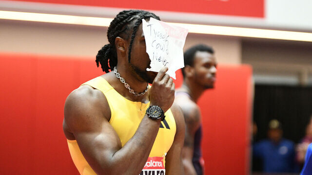BOSTON, MA - FEBRUARY 02: Noah Lyles of the United States holds a sign "Tyreek could never" after winning the men's 60m in the New Balance Indoor Grand Prix on February 2, 2025, at the TRACK at new balance in Boston, MA. Lyles won with a time of 6.52.