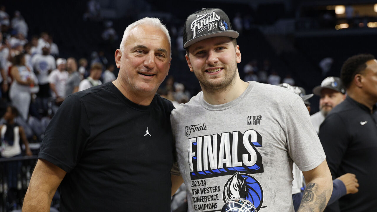 MINNEAPOLIS, MINNESOTA - MAY 30: Luka Doncic #77 of the Dallas Mavericks celebrates with is father Sasa after a 124-103 victory against the Minnesota Timberwolves in Game Five of the Western Conference Finals at Target Center on May 30, 2024 in Minneapolis, Minnesota.