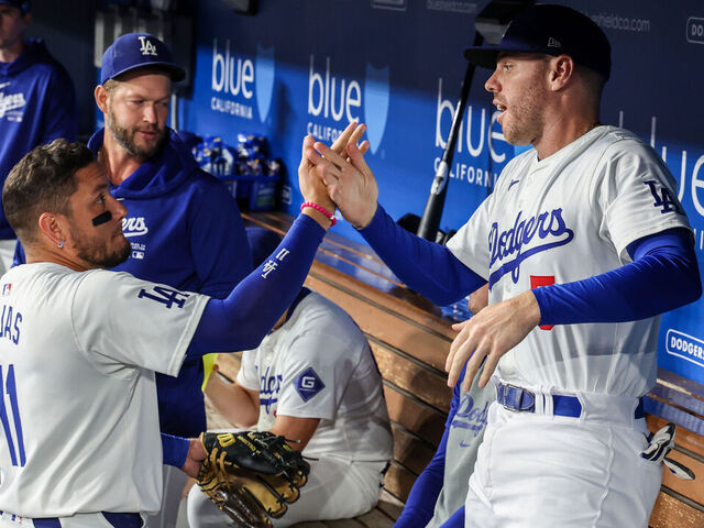 Los Angeles, CA, Tuesday, September 24, 2024 - Los Angeles Dodgers first base Freddie Freeman (5) and shortstop Miguel Rojas in the dugout during a game against the San Diego Padres at Dodger Stadium. (Robert Gauthier/Los Angeles Times via Getty Images)