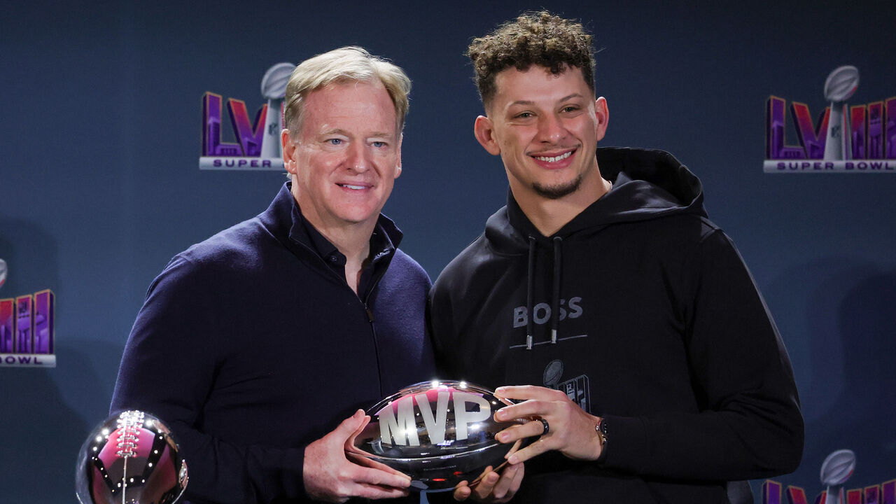 LAS VEGAS, NEVADA - FEBRUARY 12: NFL Commissioner Roger Goodell (L) poses with quarterback Patrick Mahomes #15 of the Kansas City Chiefs and the MVP award during a news conference for the winning head coach and MVP of Super Bowl LVIII at the Mandalay Bay Convention Center on February 12, 2024 in Las Vegas, Nevada.