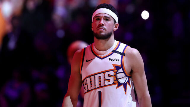 PHOENIX, ARIZONA - JANUARY 27: Devin Booker #1 of the Phoenix Suns looks on during the game against the LA Clippers at Footprint Center on January 27, 2025 in Phoenix, Arizona. The Suns defeated the Clippers 111-109.