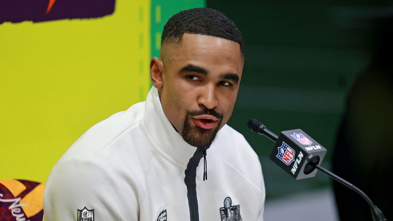 NEW ORLEANS, LOUISIANA - FEBRUARY 3: Philadelphia Eagles quarterback Jalen Hurts answers questions on the field inside the Caesars Superdome during the Super Bowl Opening Night on February 3, 2025 in New Orleans, Louisiana. The Philadelphia Eagles and Kansas City Chiefs were made available for interviews during an energetic, New Orleans-themed event ahead of next Sunday's Super Bowl LIX.