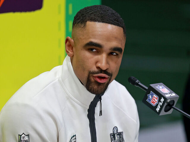 NEW ORLEANS, LOUISIANA - FEBRUARY 3: Philadelphia Eagles quarterback Jalen Hurts answers questions on the field inside the Caesars Superdome during the Super Bowl Opening Night on February 3, 2025 in New Orleans, Louisiana. The Philadelphia Eagles and Kansas City Chiefs were made available for interviews during an energetic, New Orleans-themed event ahead of next Sunday's Super Bowl LIX.