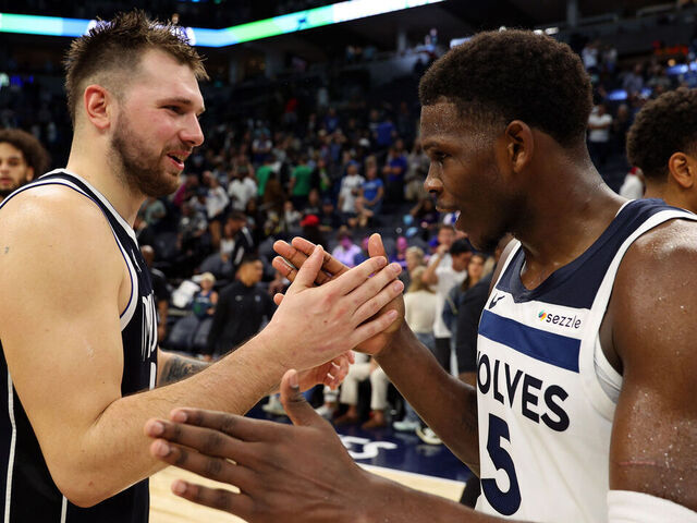 MINNEAPOLIS, MINNESOTA - OCTOBER 29: Luka Doncic #77 of the Dallas Mavericks and Anthony Edwards #5 of the Minnesota Timberwolves shake hands after the game at Target Center on October 29, 2024 in Minneapolis, Minnesota. The Mavericks defeated the Timberwolves 120-114.