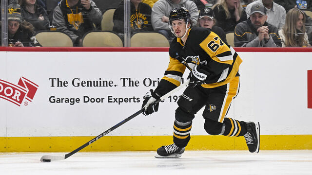 PITTSBURGH, PA - FEBRUARY 01: Pittsburgh Penguins right wing Rickard Rakell (67) skates with the puck during the third period in the NHL game between the Pittsburgh Penguins and the Nashville Predators on February 1, 2025, at PPG Paints Arena in Pittsburgh, PA.