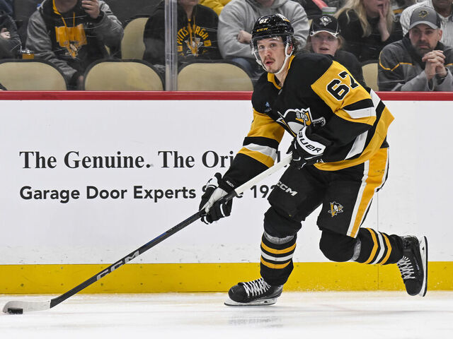 PITTSBURGH, PA - FEBRUARY 01: Pittsburgh Penguins right wing Rickard Rakell (67) skates with the puck during the third period in the NHL game between the Pittsburgh Penguins and the Nashville Predators on February 1, 2025, at PPG Paints Arena in Pittsburgh, PA.