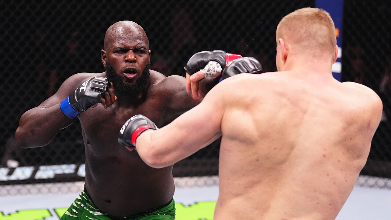 RIYADH, SAUDI ARABIA - FEBRUARY 01: (L-R) Jairzinho Rozenstruik of Suriname punches Sergei Pavlovich of Russia in a heavyweight fight during the UFC Fight Night event at anb Arena on February 01, 2025 in Riyadh, Saudi Arabia.